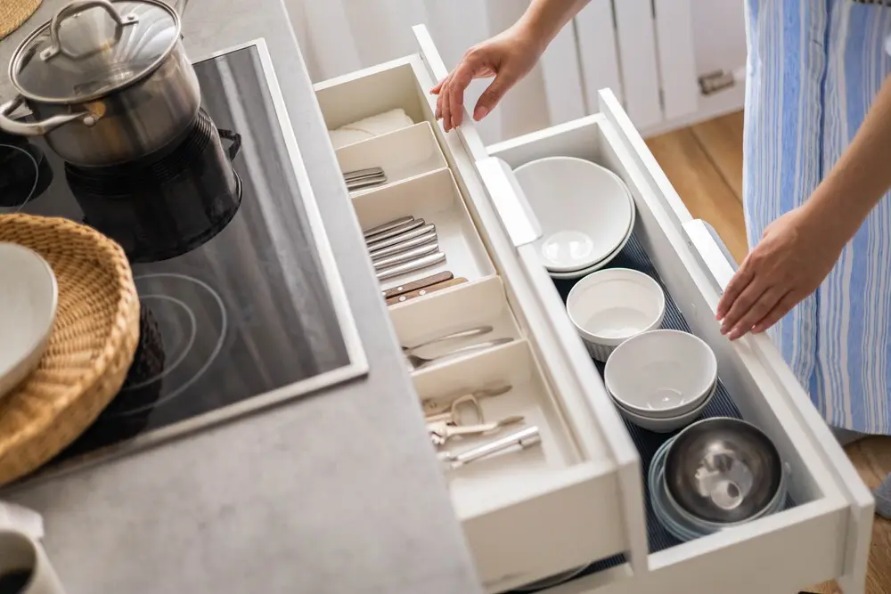 Organized drawer being opened in a home