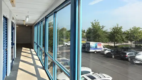 Window view of the exterior of Self Storage - Plus Ball Street.