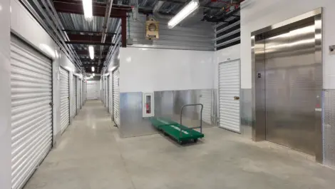 Indoor storage units and an elevator at Self Storage Plus - Beaver Dam.