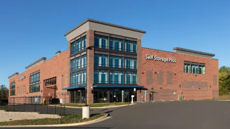 Self Storage Plus red brick building from a closer view.