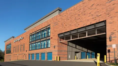 Self Storage Plus red brick building view of outdoor/ indoor storage units.