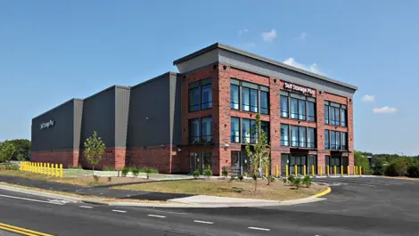 Self Storage Plus red brick building view from across the street.