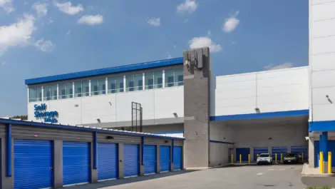 Self Storage Plus outdoor storage units with blue doors.