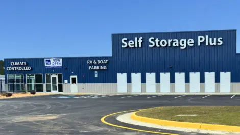 Self Storage Plus building with RV and Boat parking as well as climate controlled advertized on the building.