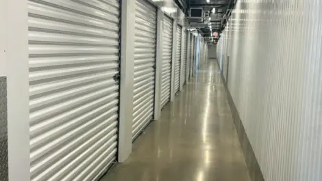 Hallway view of indoor storage units.