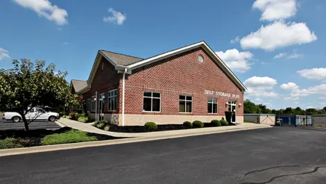 Self Storage Plus brick building from side view.