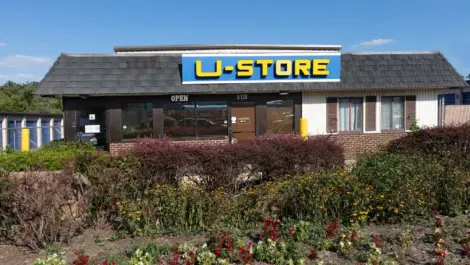 Front view of U-Store with flowered landscaping in the front.