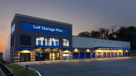 Night view of Self Storage Plus building.