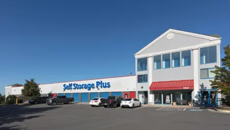 Self Storage Plus parking lot in front of storage building.