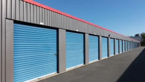 Row of blue storage units with black outer trim.