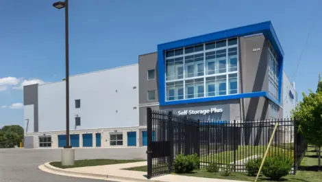 Front view of storage facility with open security gate.