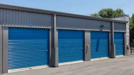 Four blue storage units with gray trim.