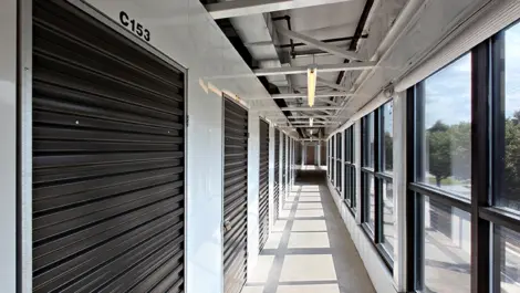 Second floor inddor storage units with black doors.