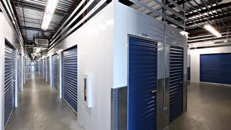 Indoor self storage units with blue doors.