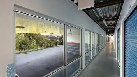 Hallway view of first-floor indoor storage units.