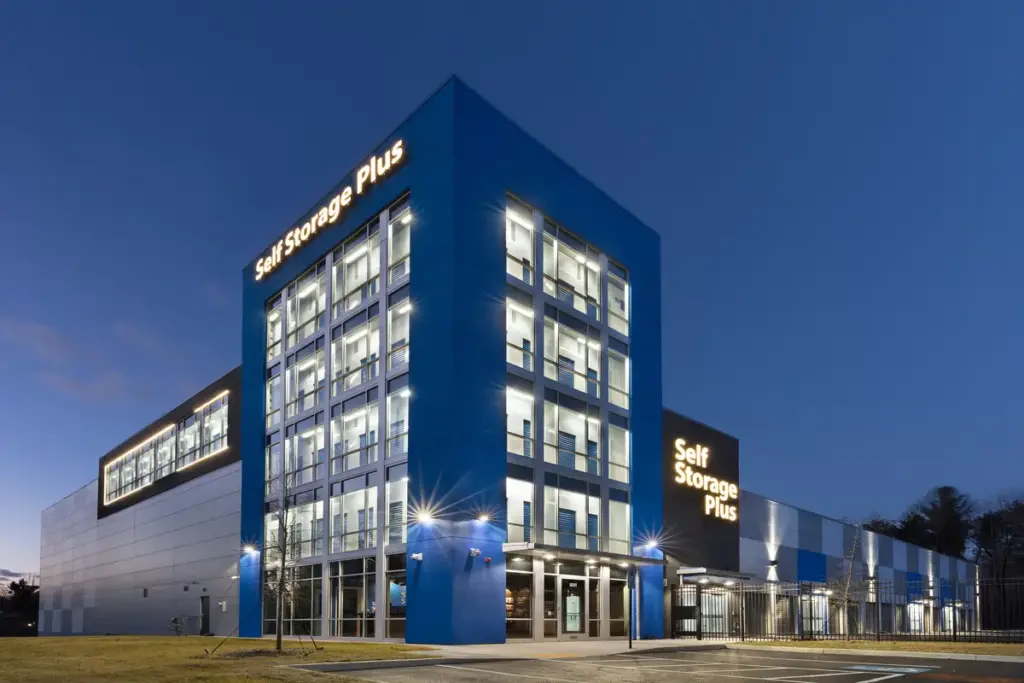 Night view of a Self Storage Plus storage facility with the lights shining bright.