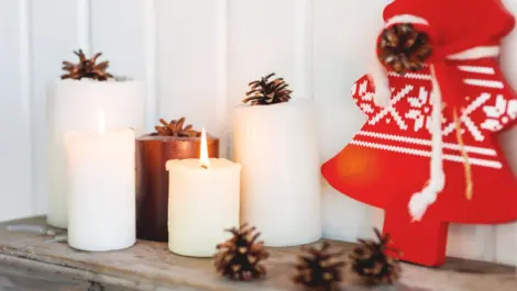 Christmas candles and pinecone decor.